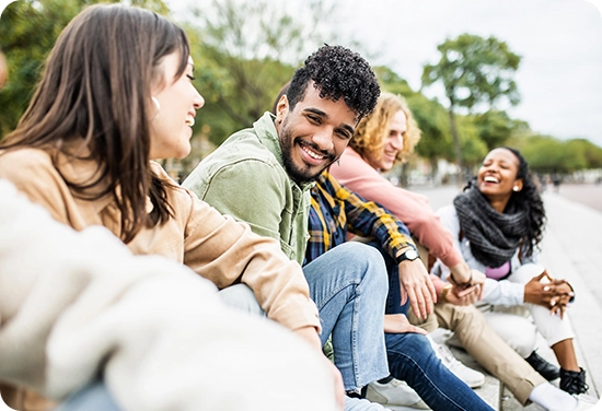 Group of college students sitting outside