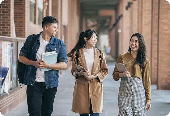 Group of students walking outside and talking