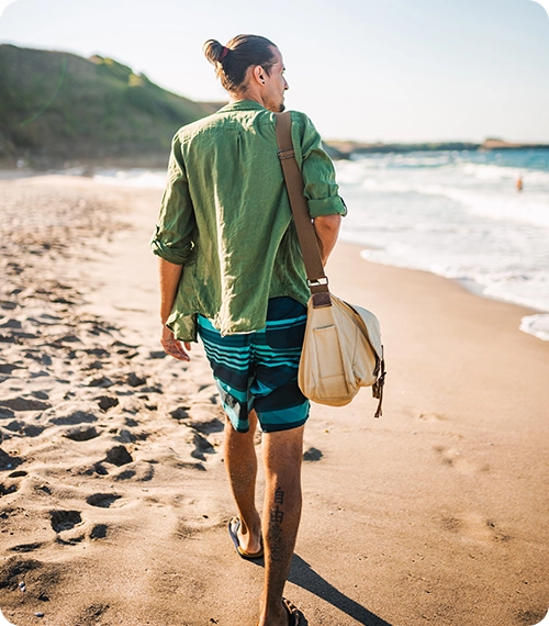 a man walking on a beach