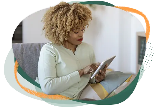 Woman sitting on the couch with her electronic tablet