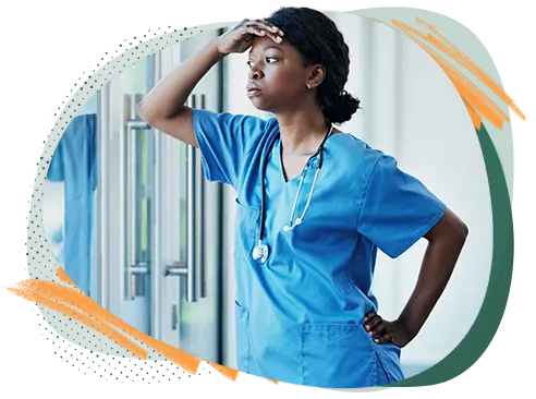 A stressed female doctor looking out the window